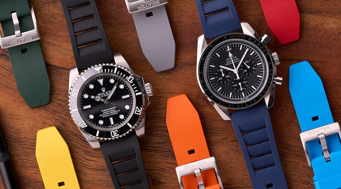 Three Galaxy Watch bands in Australia — FKM rubber, leather, and NATO — laid flat beside a Samsung Galaxy Watch