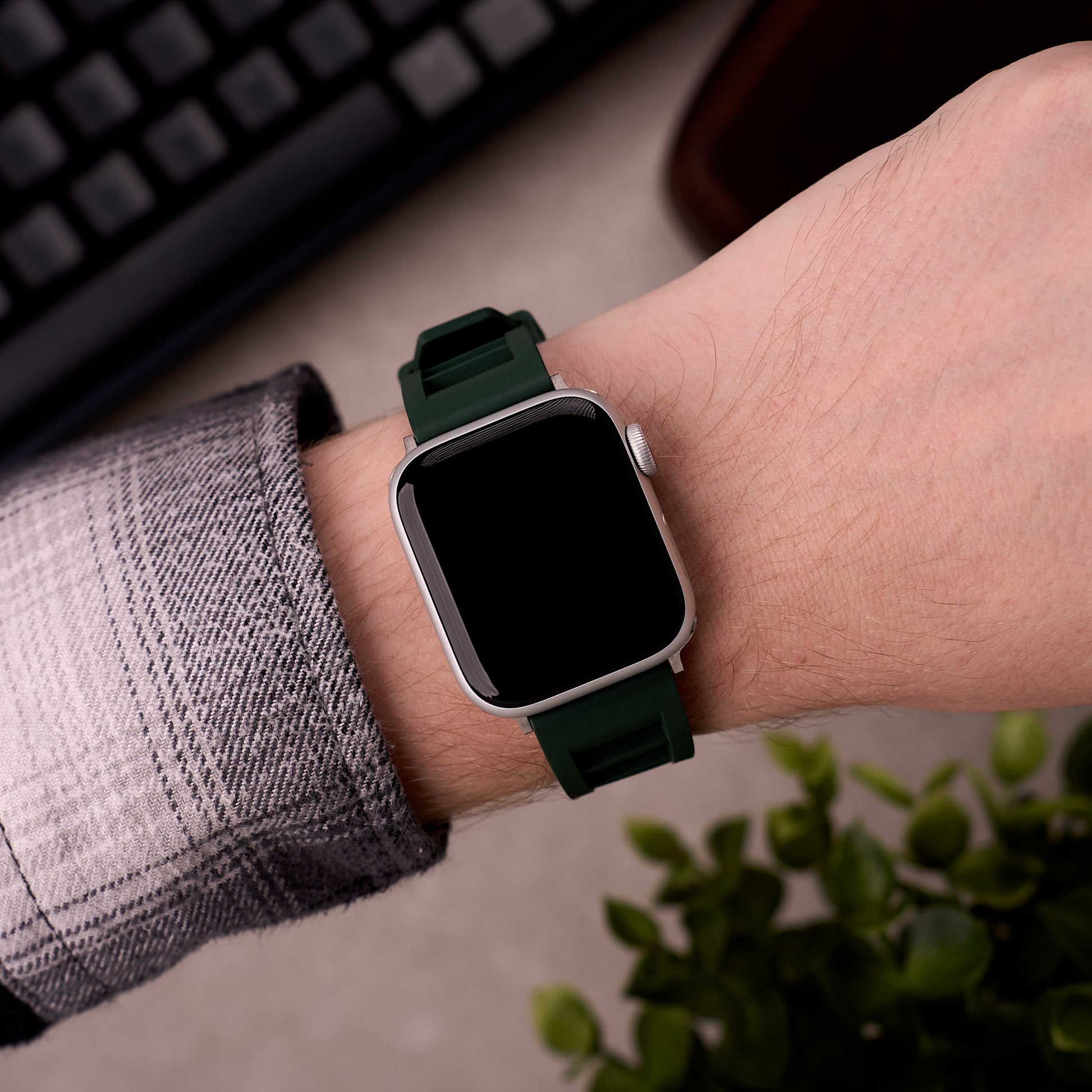 The Bastion FKM rubber Apple Watch band in Forest Green worn on the wrist with an Apple Watch