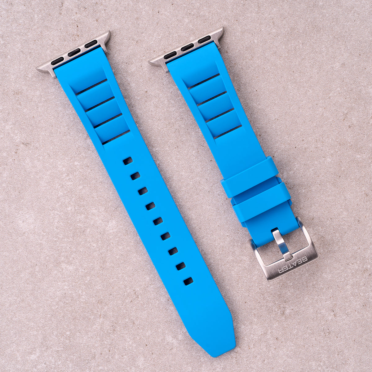 The Bastion FKM rubber Apple Watch band in Light Blue, front view showing the full strap and buckle