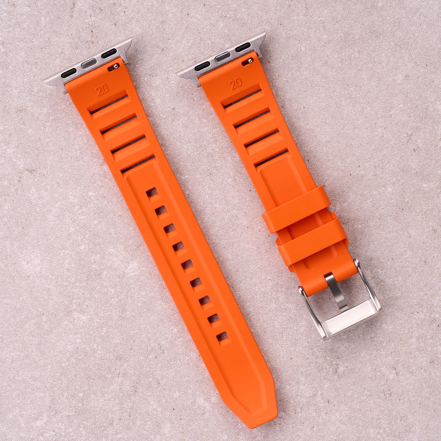 The Bastion FKM rubber Apple Watch band in Orange, back view showing the quick release pin and strap size marking