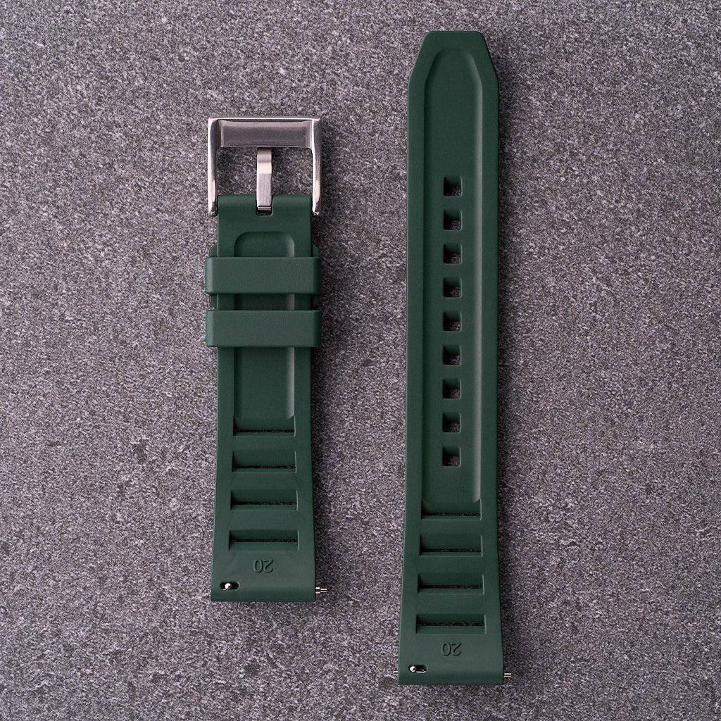 Underside close-up of The Bastion forest green FKM rubber strap with textured lining and hardware for 20mm 22mm and 24mm lug widths.