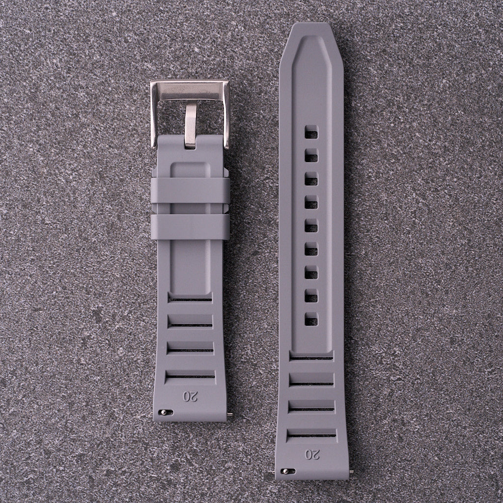 Close-up of underside of The Bastion grey FKM rubber strap showing channelled design and hardware for 20mm 22mm and 24mm watches.