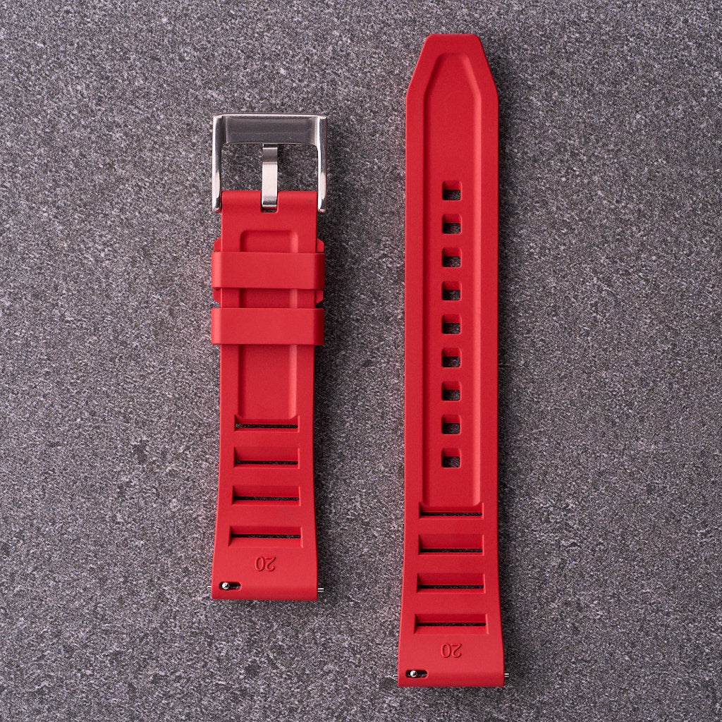 Underside of The Bastion red FKM rubber strap highlighting channelled texture and buckle, compatible with 20mm 22mm and 24mm lugs.