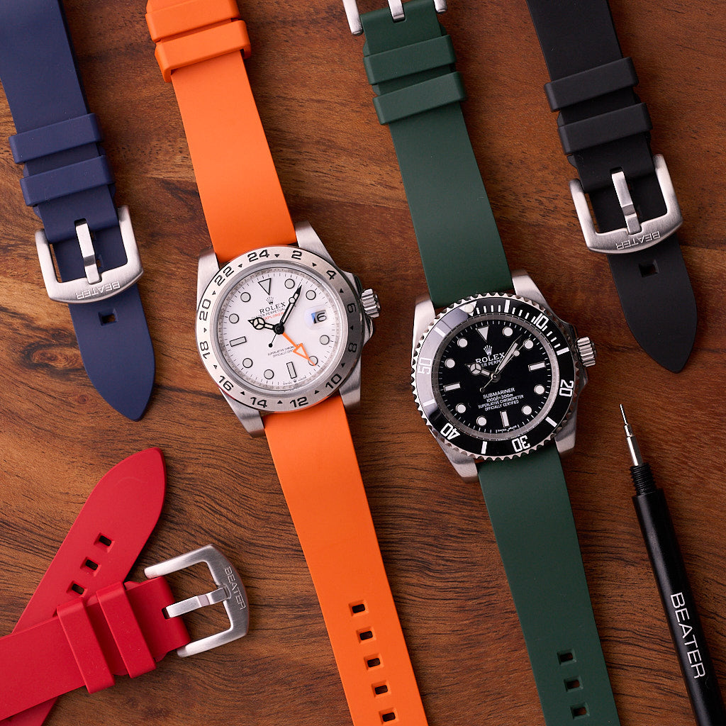 Collection of The Callaway FKM rubber watch straps in multiple colours with black, forest green, orange, navy blue and red strap visible, available in 18mm 20mm 22mm and 24mm widths.