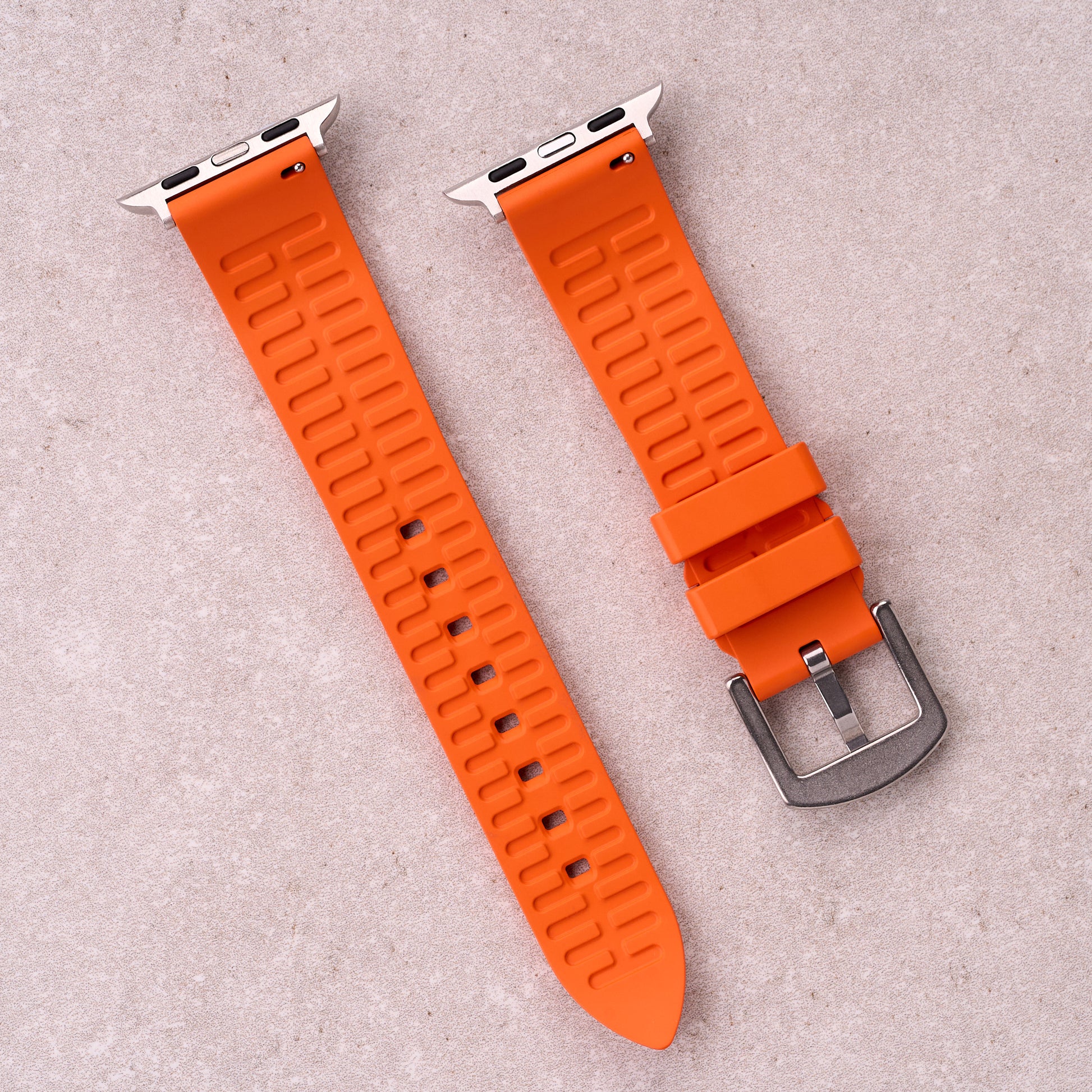 The Callaway FKM rubber Apple Watch band in Orange, back view showing the quick release pin and strap size marking