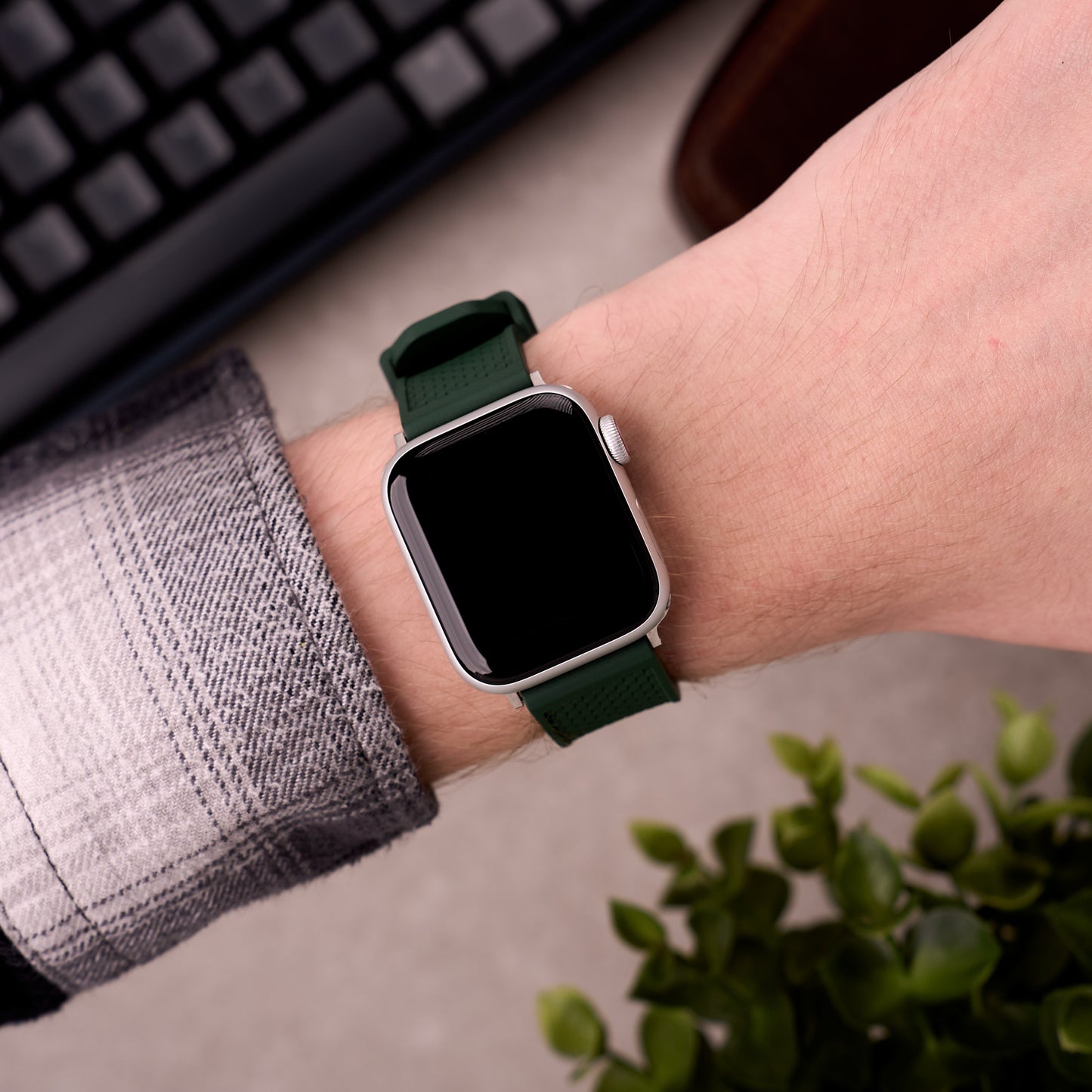 The Gatton FKM rubber Apple Watch band in Forest Green worn on the wrist with an Apple Watch