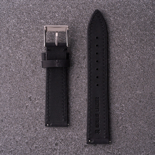 Underside of The Harrington black leather watch band showing smooth lining and multiple adjustment holes for a precise fit.