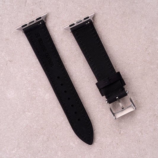 The Harrington leather Apple Watch band in Black, back view showing the quick release pin and strap size marking