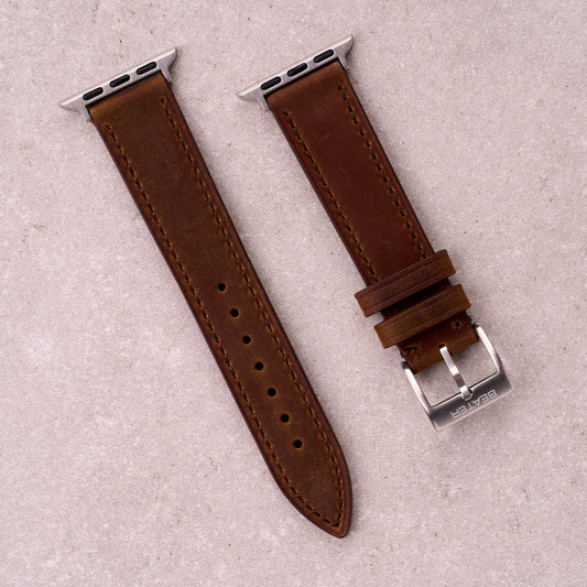 The Harrington leather Apple Watch band in Brown, front view showing the full strap and buckle