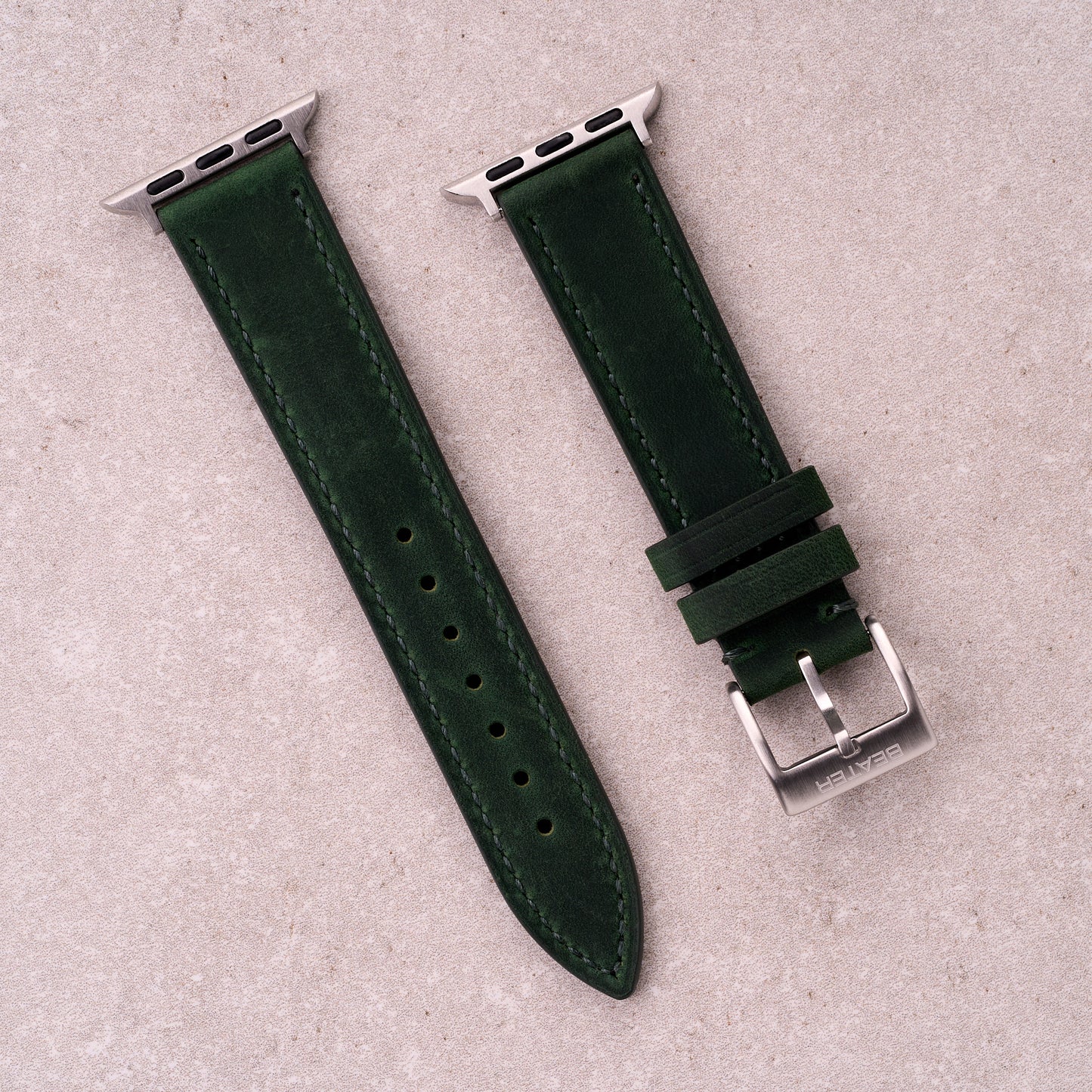 The Harrington leather Apple Watch band in Forest Green, front view showing the full strap and buckle