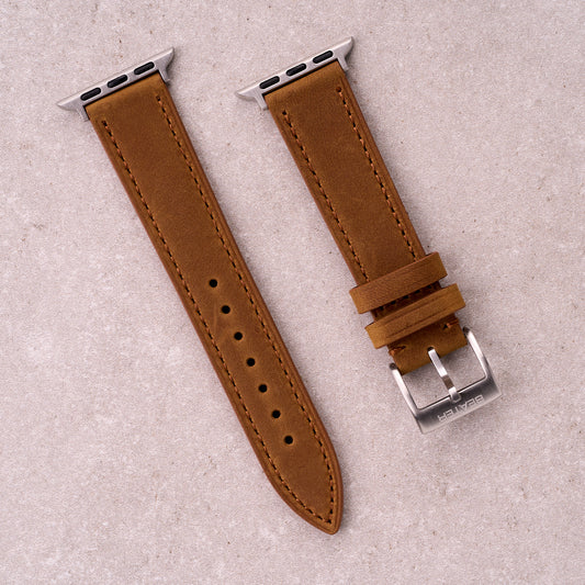 The Harrington leather Apple Watch band in Light Brown, front view showing the full strap and buckle