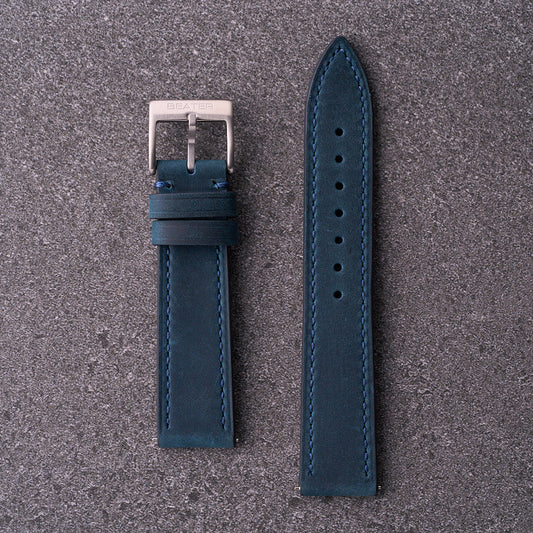 The Harrington navy blue leather watch strap with contrast brown keeper and silver buckle, tapered dress band in 18mm 20mm and 22mm lug sizes.
