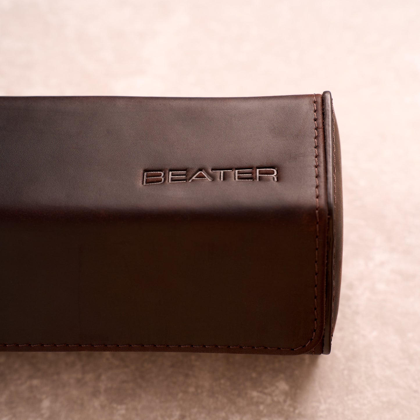 Close up of the Beater logo embossed into the leather of The Ashford watch roll