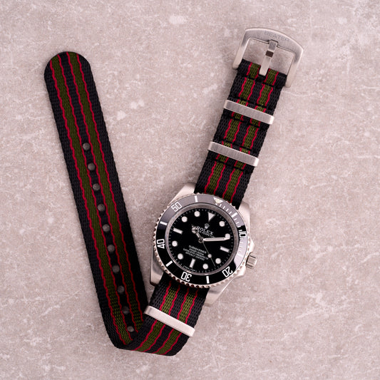 The Sentinel 007 black green and red stripe NATO strap, bold James Bond–inspired seatbelt nylon one-piece watch band with tri-colour stripes.