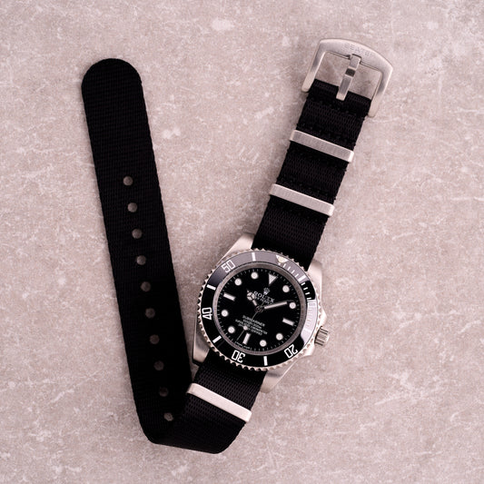 The Sentinel black seatbelt NATO strap, premium tightly woven nylon one-piece watch band with brushed hardware for everyday and tactical watches.