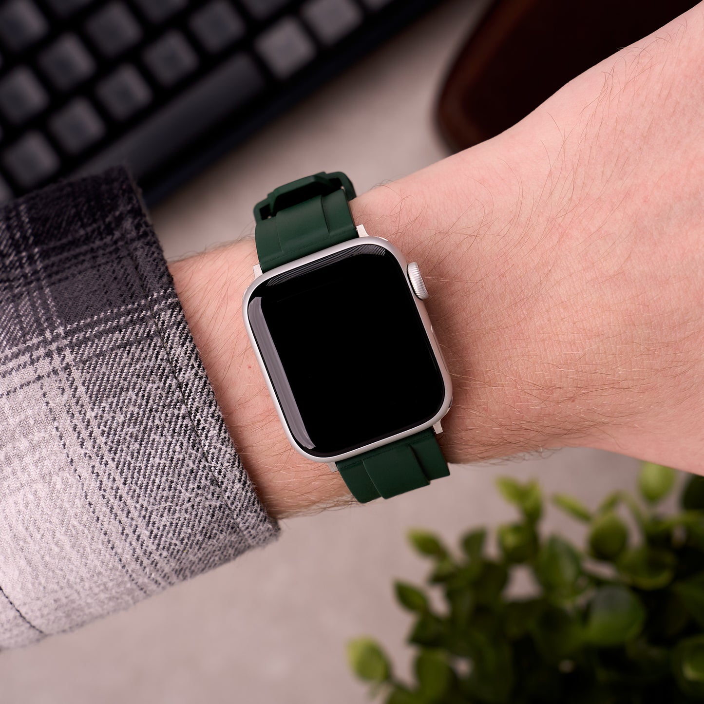 The Specter FKM rubber Apple Watch band in Forest Green worn on the wrist with an Apple Watch