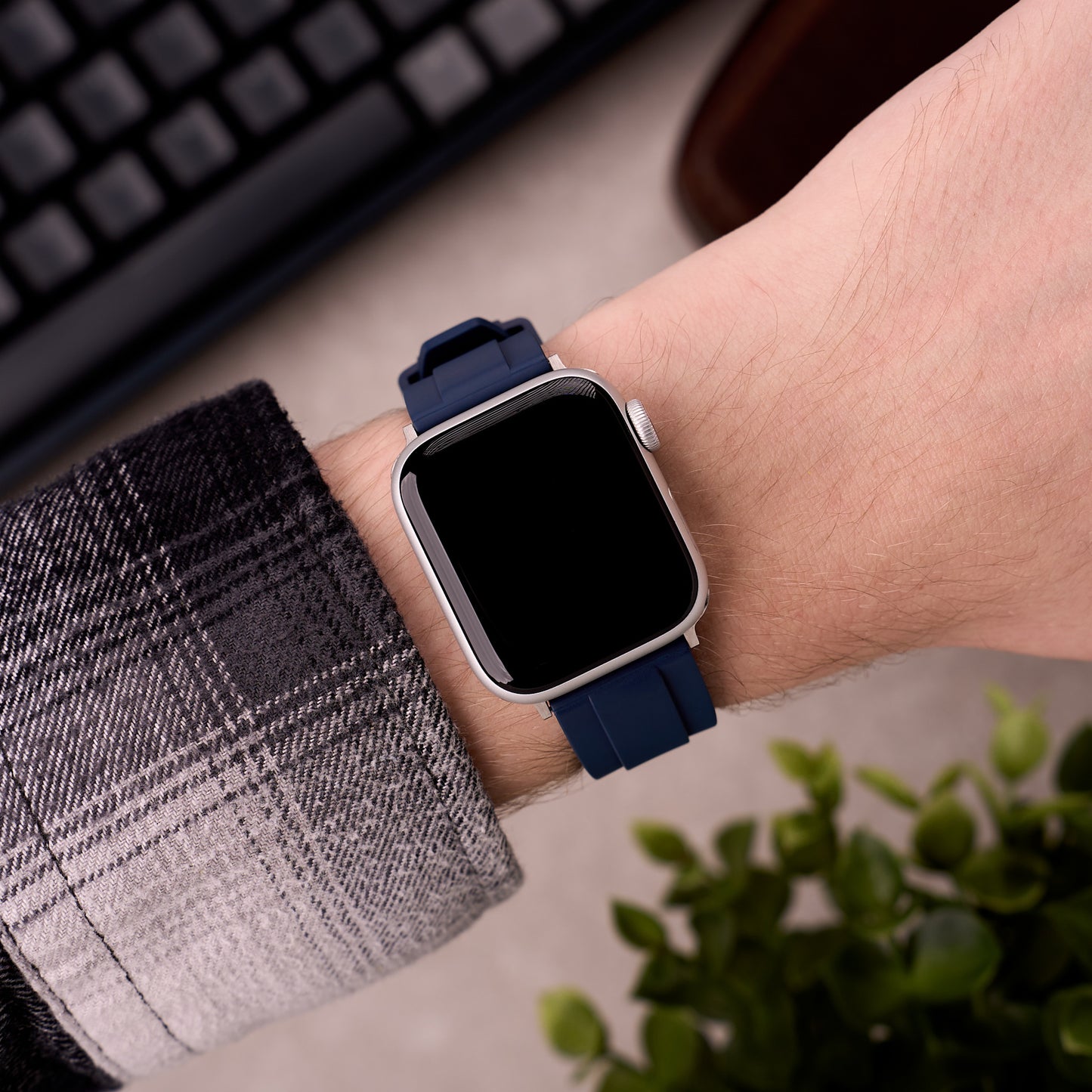 The Specter FKM rubber Apple Watch band in Navy Blue worn on the wrist with an Apple Watch