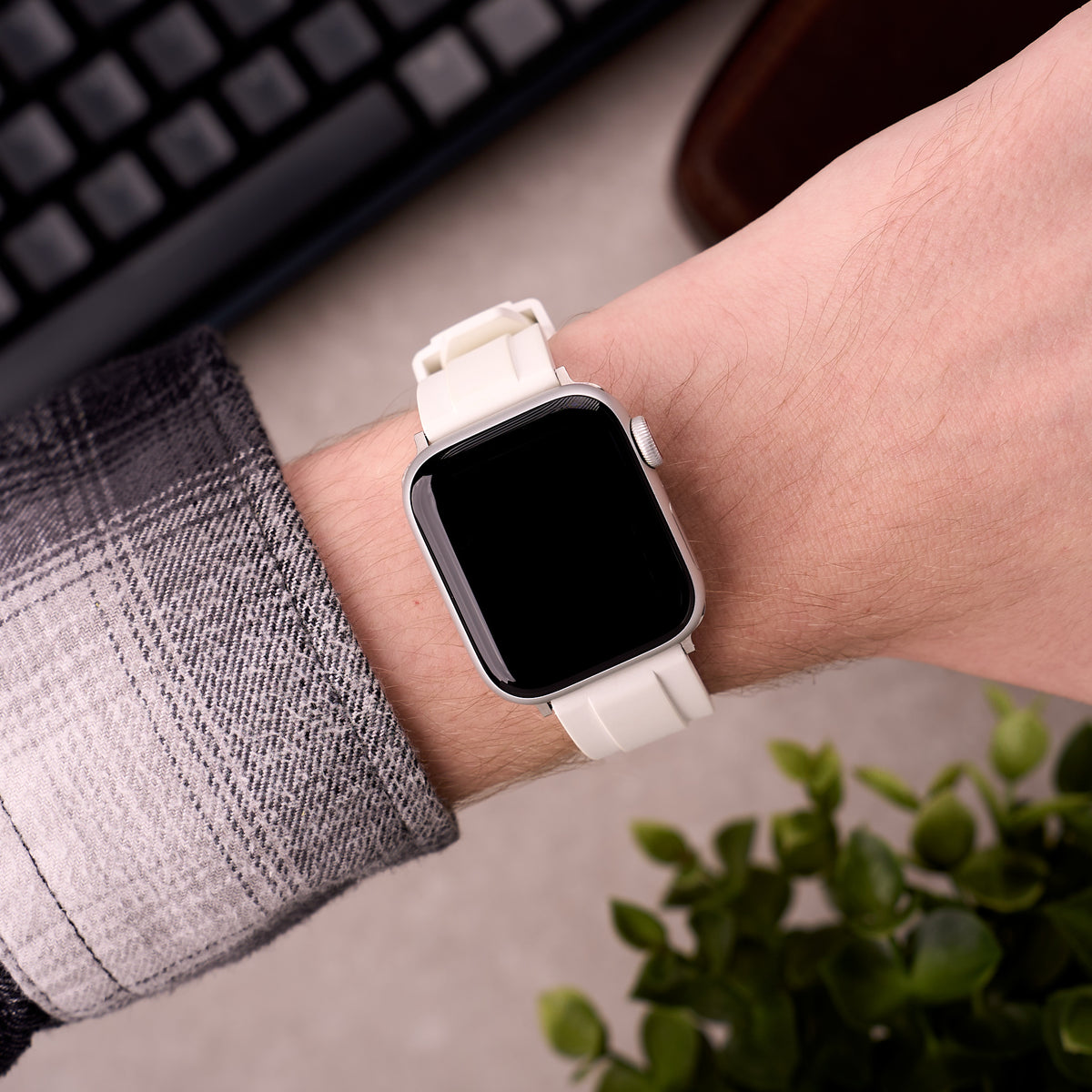 The Specter FKM rubber Apple Watch band in White worn on the wrist with an Apple Watch