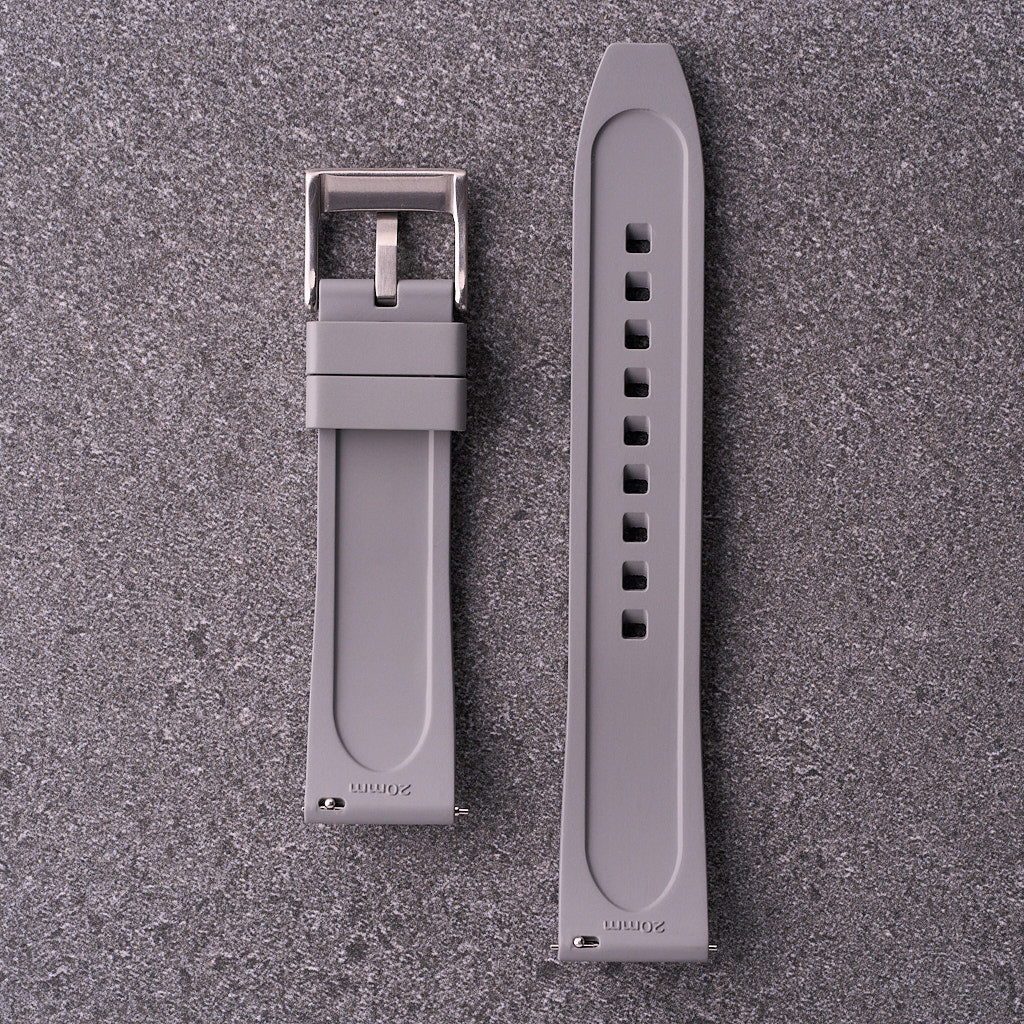 Underside of The Specter grey strap showing lightly textured rubber and steel buckle.
