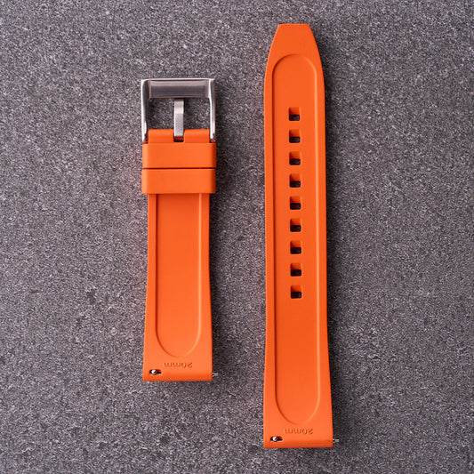 Underside of The Specter orange strap showing flexible rubber channels and buckle.