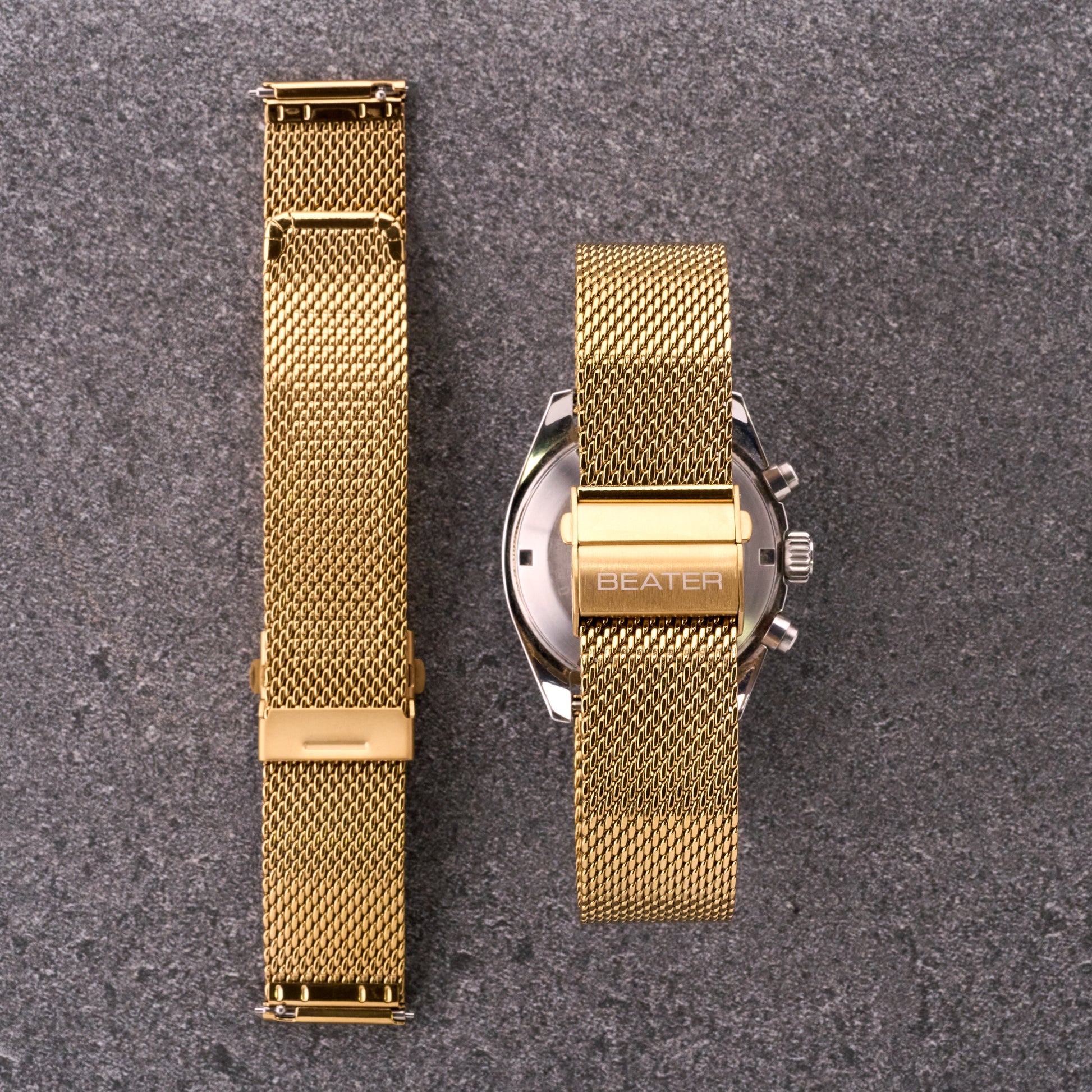 The Sterling gold mesh stainless steel bracelet shown from front and back next to a watch case, displaying mesh texture and clasp position.​