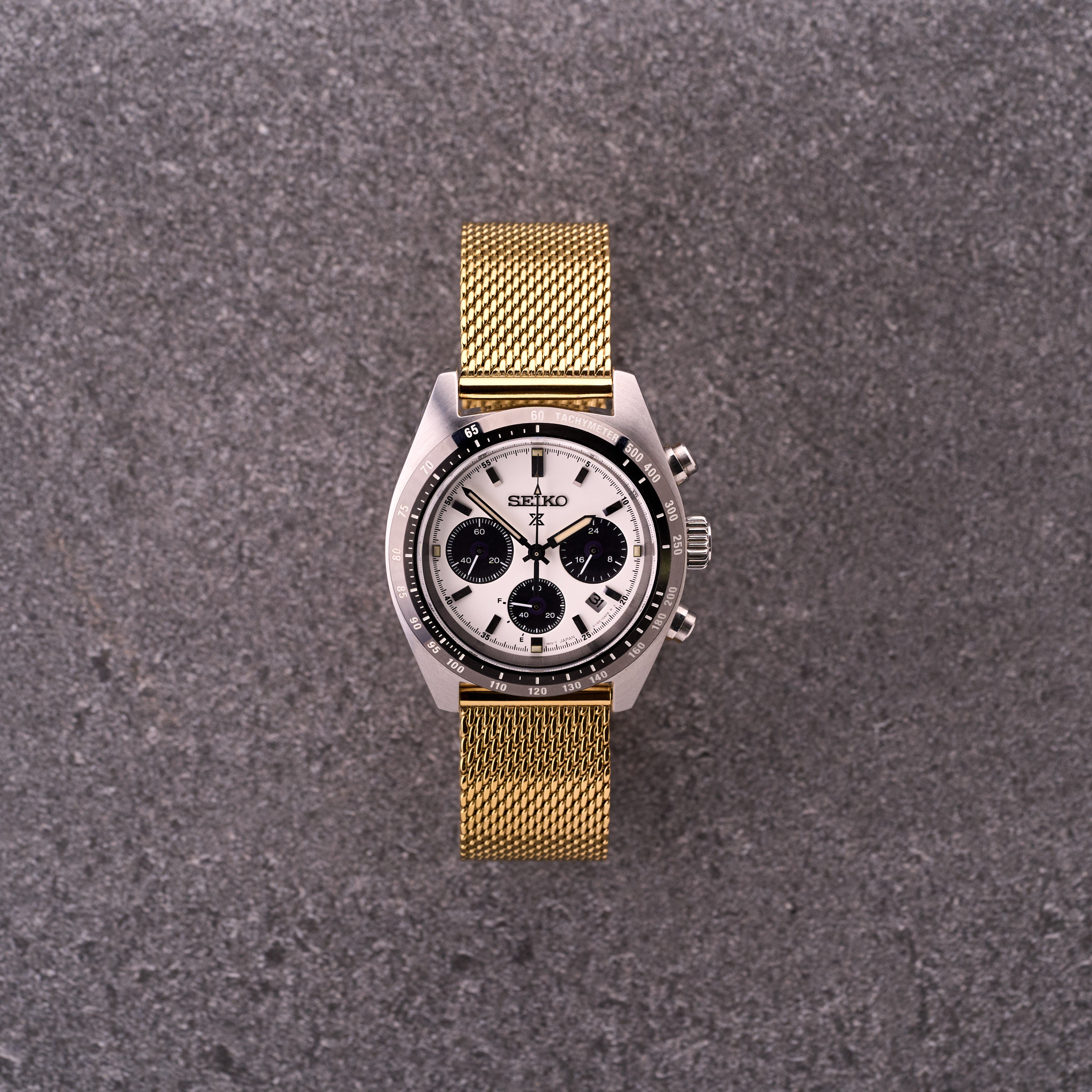 Gold The Sterling mesh stainless steel watch bracelet on a dress watch, warm gold Milanese mesh band for classic watches.​