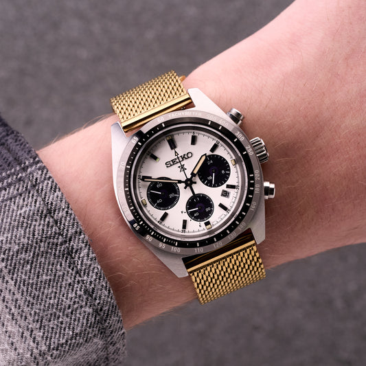 Gold The Sterling mesh stainless steel bracelet on wrist, elegant gold metal watch band styled for everyday and formal wear.