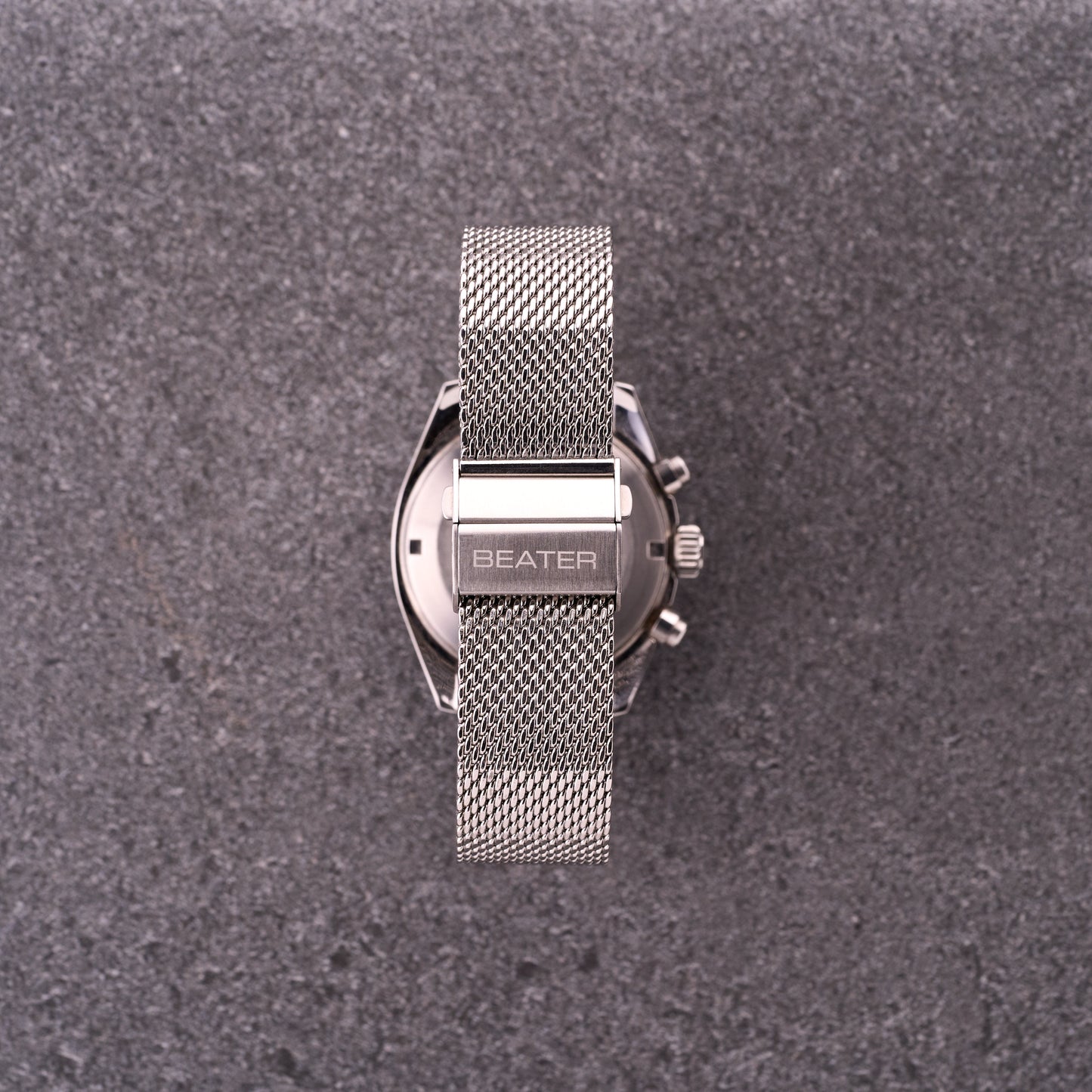 Close-up of The Sterling silver mesh bracelet clasp with BEATER logo, highlighting secure folding mechanism and dense mesh.