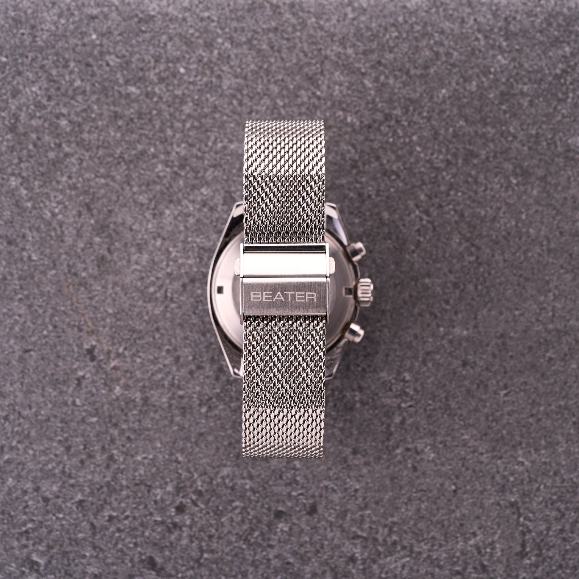 Close-up of The Sterling silver mesh bracelet clasp with BEATER logo, highlighting secure folding mechanism and dense mesh.