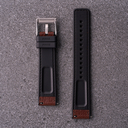 Underside of The Tailor brown strap showing black FKM rubber lining and quick-release spring bars.​
