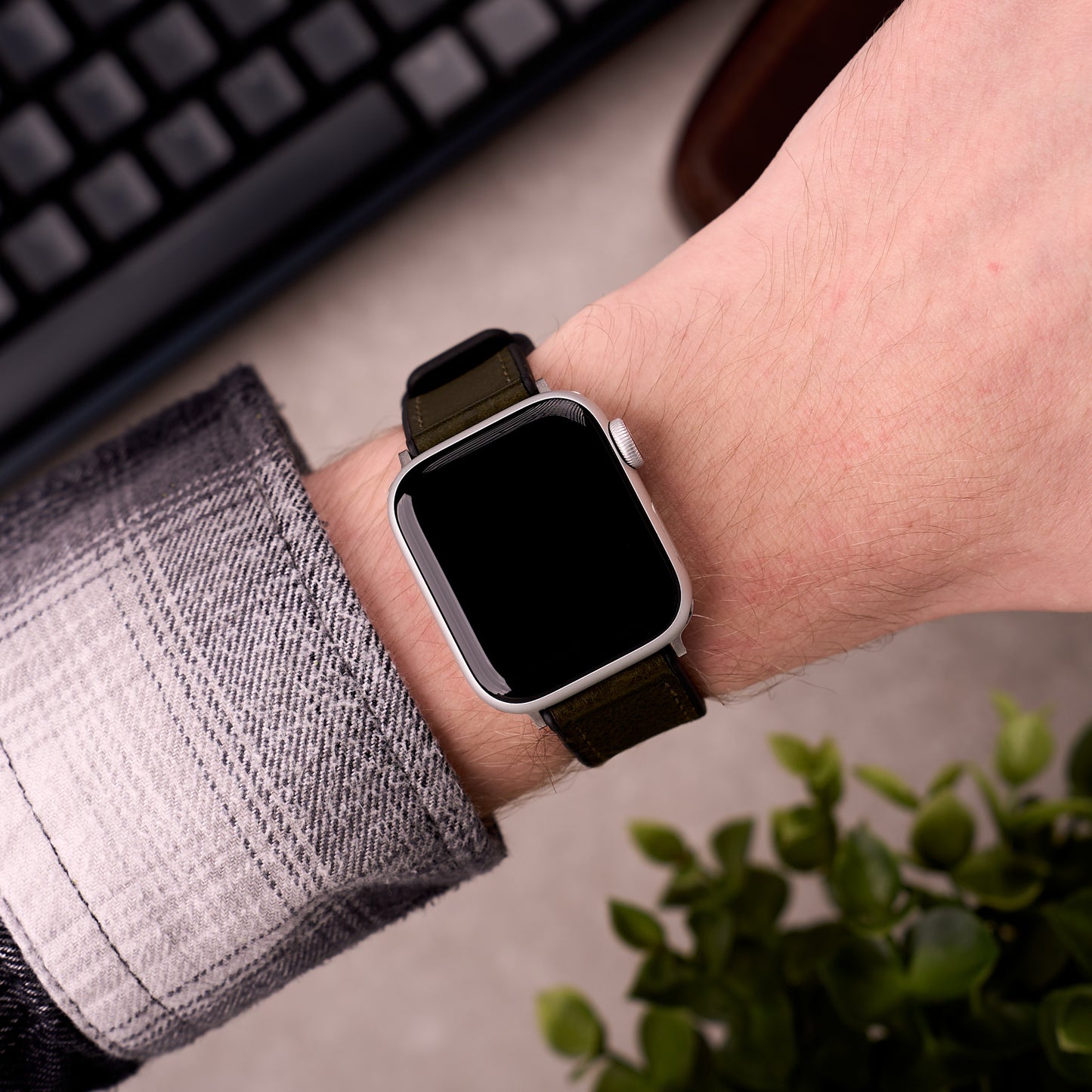 The Tailor leather and FKM rubber Apple Watch band in Army Green worn on the wrist with an Apple Watch