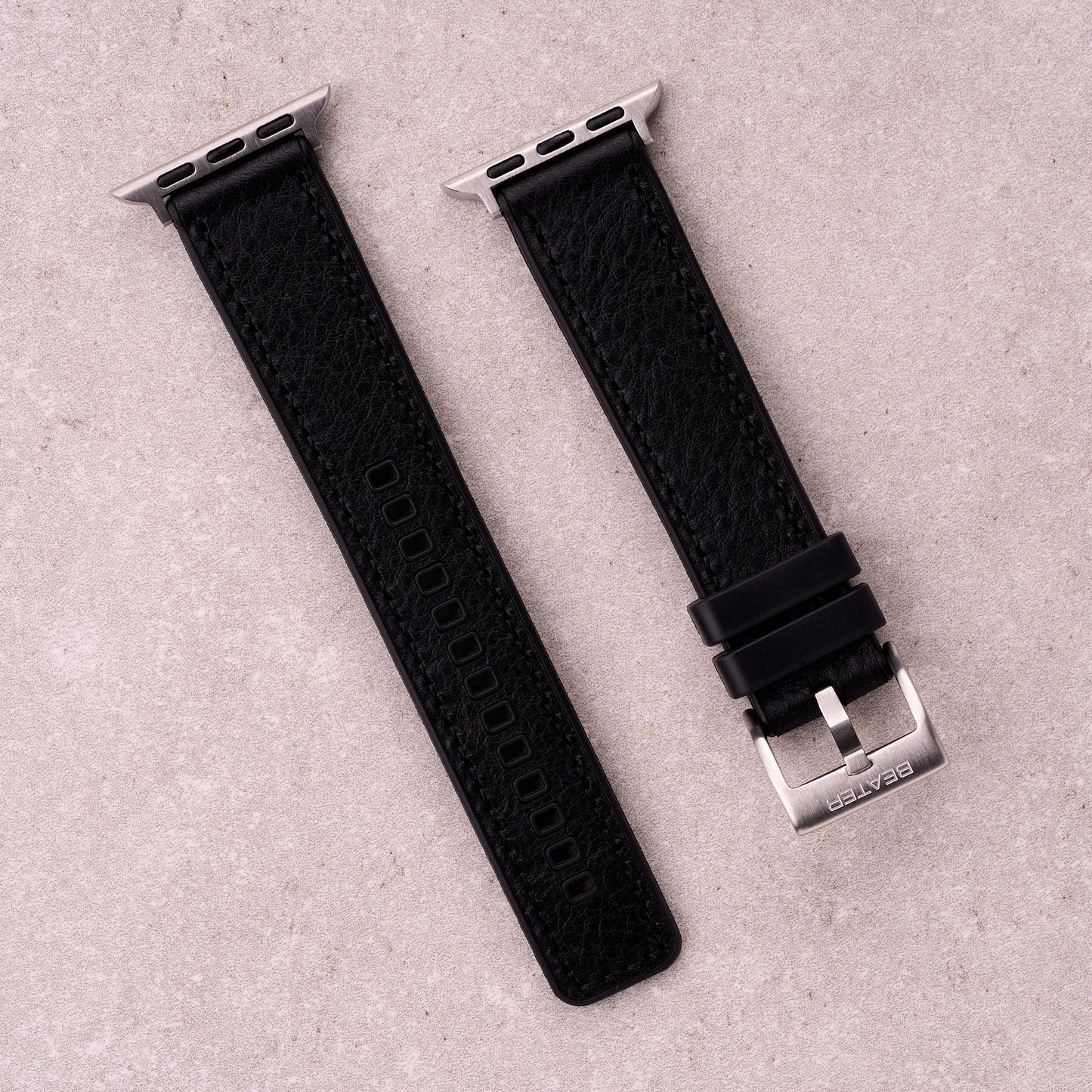 The Tailor leather and FKM rubber Apple Watch band in Black, front view showing the full strap and buckle