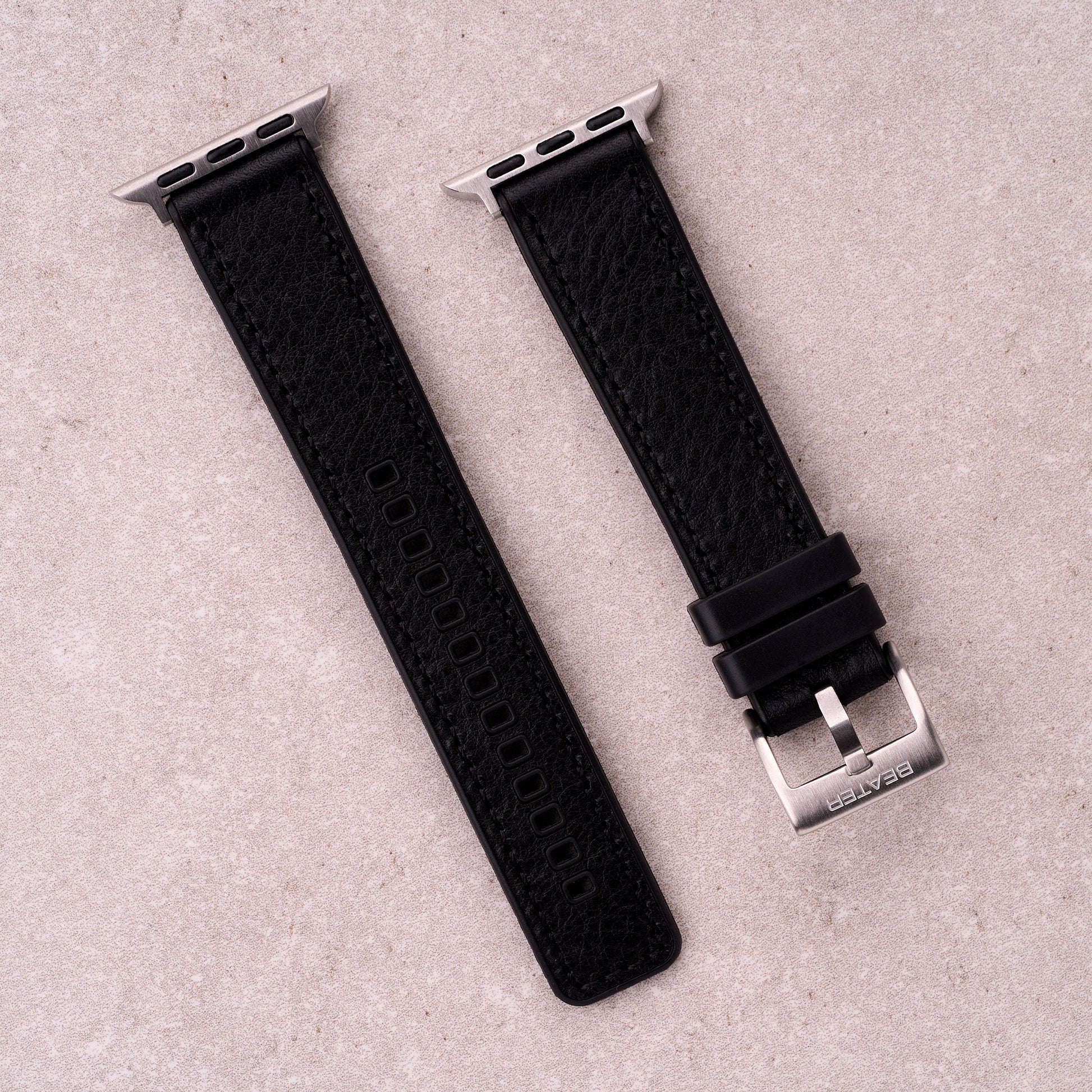 The Tailor leather and FKM rubber Apple Watch band in Black, front view showing the full strap and buckle