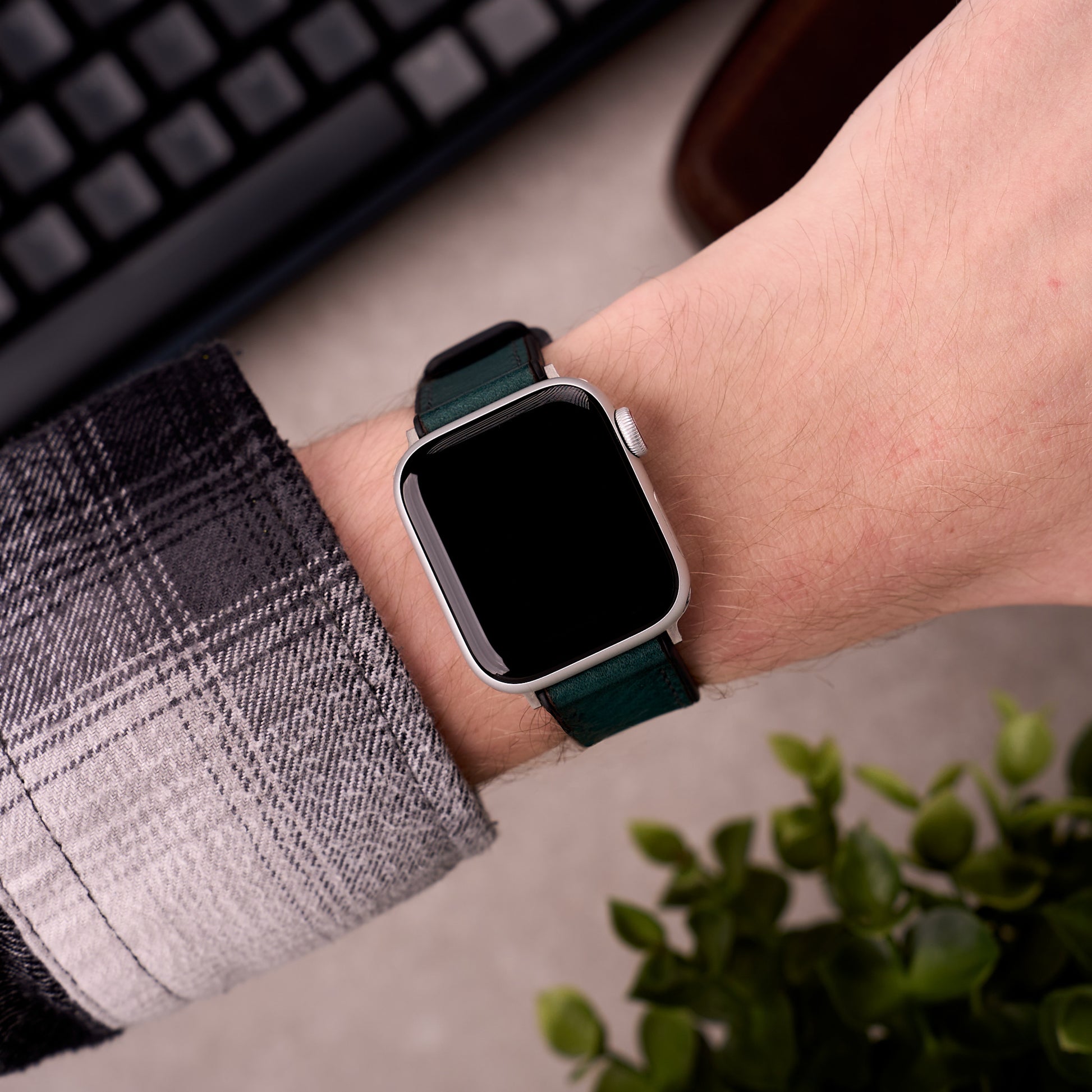 The Tailor leather and FKM rubber Apple Watch band in Blue worn on the wrist with an Apple Watch