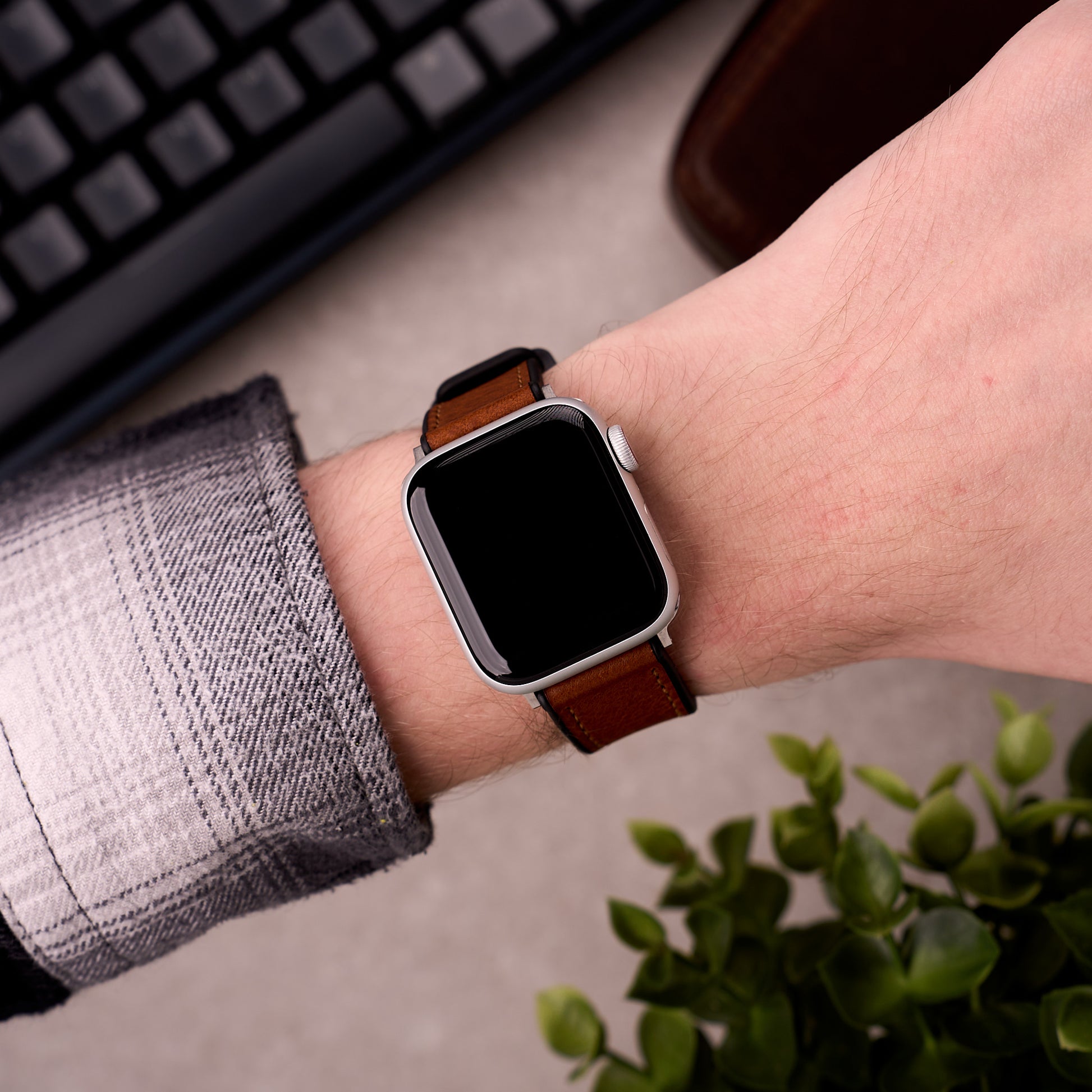 The Tailor leather and FKM rubber Apple Watch band in Light Brown worn on the wrist with an Apple Watch