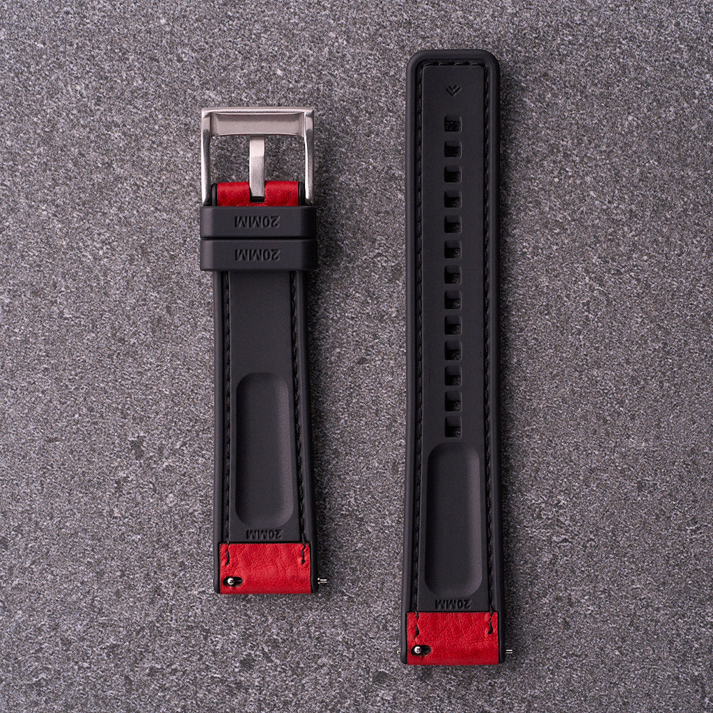 Underside of The Tailor red strap showing black FKM rubber lining with quick-release fittings.