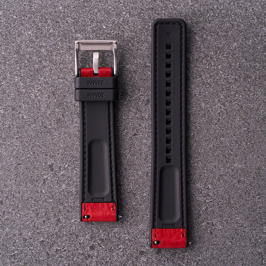 Underside of The Tailor red strap showing black FKM rubber lining with quick-release fittings.